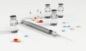 syringe and pill capsules